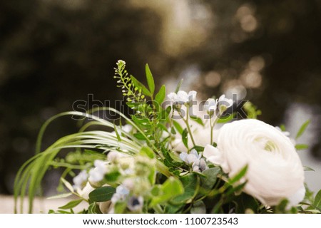 Beautiful wedding bouquet made of white flowers and greenery