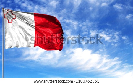 Flag of malta on flagpole against the blue sky Royalty-Free Stock Photo #1100762561