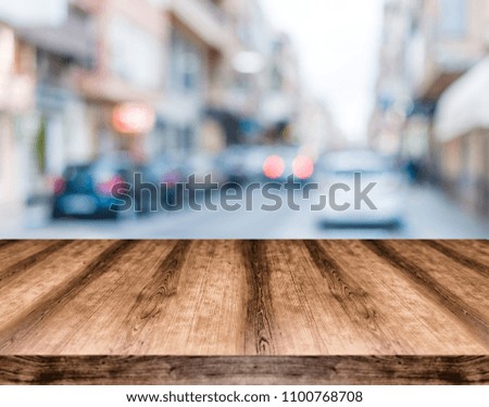 Wooden empty table board in front of blurred background. Can be used for display or montage any product. Mock up for display your product.