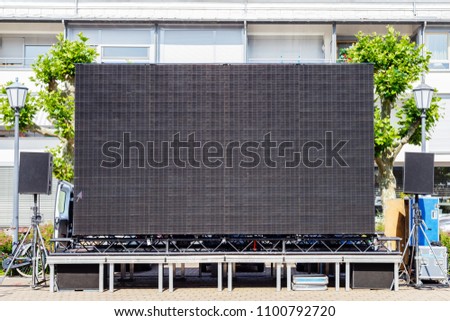 Large black Open-Air Public Screen for Sport,  Event,  Music,  Promotion  Public Viewing in German city center, frame text place, copy space