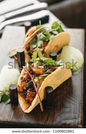 Delicious tacos with vegetables and parsley, Mexican cuisine