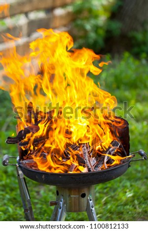Close up picture of fire on a barbeque - preparation for cookout, grilling