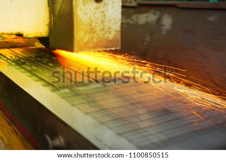 Grinding of metal on a flat machine tool with water cooling. Metalworking industry. Picture with tint.