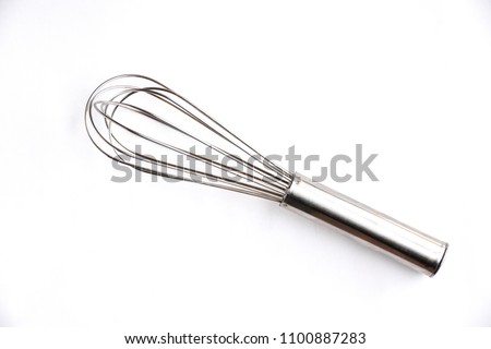 Close up of Silver whisk isolated on white background. Top view on food tool background view. Royalty-Free Stock Photo #1100887283