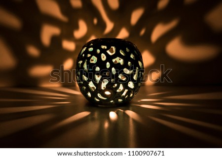 The candle's reflection in the soft light for Ramadan, religion ,greeting card or background photo concept.