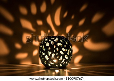 The lantern's reflection in the soft light for Ramadan, religion ,greeting card,Friday message or background photo concept.