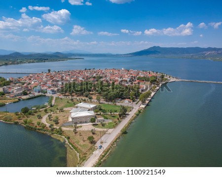 Aerial scenic view of the famous island - town of Aitoliko in Aetolia - Akarnania, Greece is situated in the middle of Messolonghi Lagoon and it is known as the Little Venice of Greece. Royalty-Free Stock Photo #1100921549