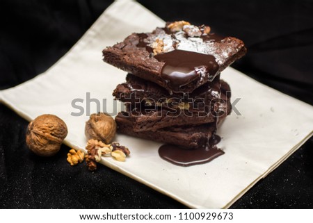 this is a picture of chocolate brownie which is dip in the liquid chocolate