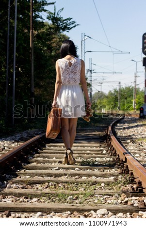 Woman on the railway walking
