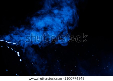 blue smoke clouds on dark background
