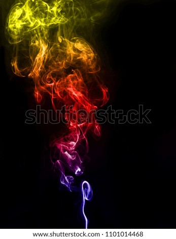 abstract fragment movement of colorful smoke on black background.