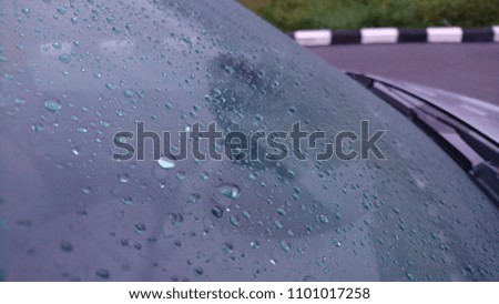 Rain drops on the car window. Abstract background