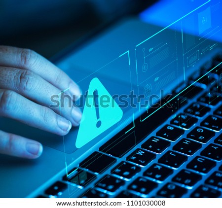 Woman scrolling on a laptop Royalty-Free Stock Photo #1101030008