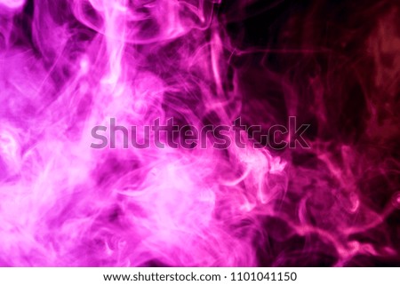 Thick pink smoke on a black isolated background. Background from the smoke of vape
