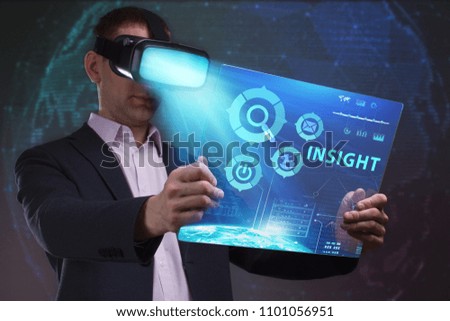 Business, Technology, Internet and network concept. Young businessman working in virtual reality glasses sees the inscription: Insight