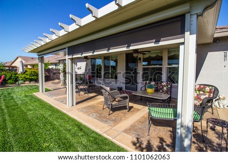 Modern Rear Yard Patio With Furniture Royalty-Free Stock Photo #1101062063