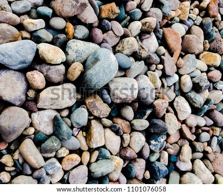 Colorful river rocks of various sizes and shapes