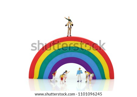 Miniature people : children and student playground in city park with rainbow background,Education,Play and learn concept.