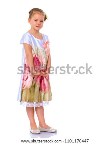Portrait of a trendy little girl on a white background. The concept of photo for the cover of the magazine, stylish children's clothing. Isolated.