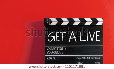 get alive title on wooden clapper board