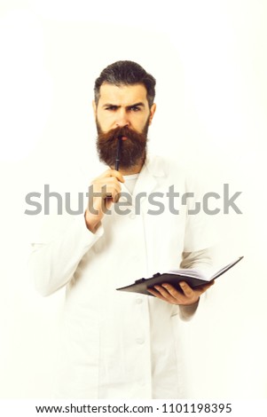 Bearded brutal caucasian doctor or postgraduate student