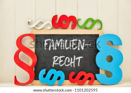 German word Familienrecht (family law) as text on blackboard with many colorful paragraphs