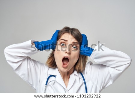  doctor surprised holding on to head medicine                              