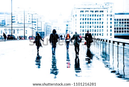 City commuters. High key blurred image of unrecognizable workers walking in London. Bleached effect. Concept for Londoners, modern life, management, corporate, future cities, business, migration