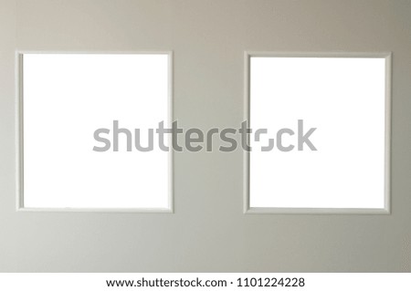 Twins blank window frame on wall, symmetric arrangement