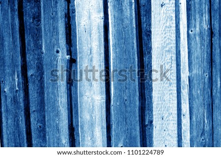 Wooden fence pattern in navy blue color. Abstract background and texture for design.