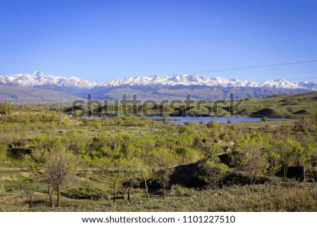 Scenic panoramic view of Tian Shan mountains near Karakol town, Kyrgyzstan