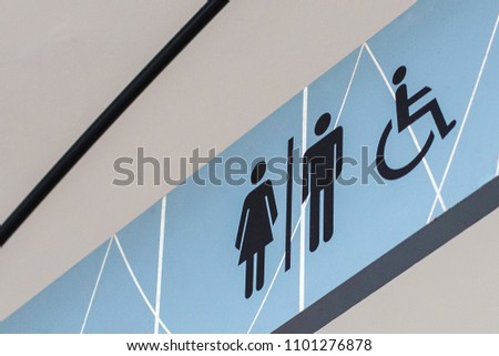 Bathroom sign on a blue background