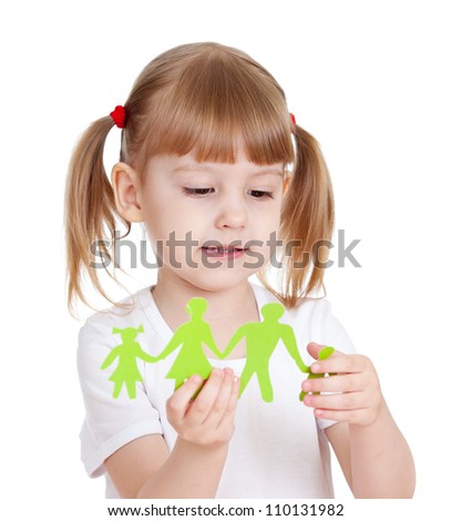 Little girl holding family cutting from paper and dreaming about brother