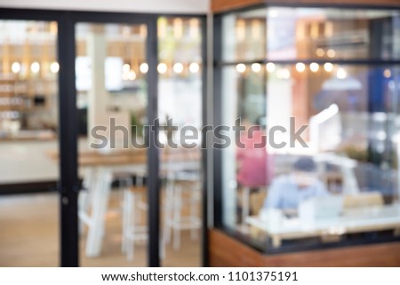 Abstract blurred restaurant window - vintage style picture with bokeh light.