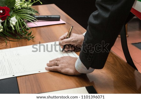 Signing a marriage document