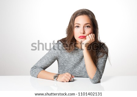 Portrait of frustrated tired looking brunette woman.