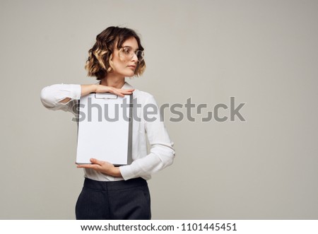  place free business woman holding a folder-tablet                              