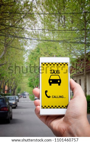 Using smartphone mobile app to call taxi. Man dialing cab number on the street.