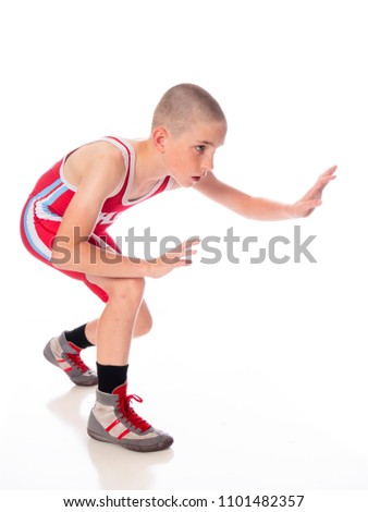 Youth wrestler in red singlet
