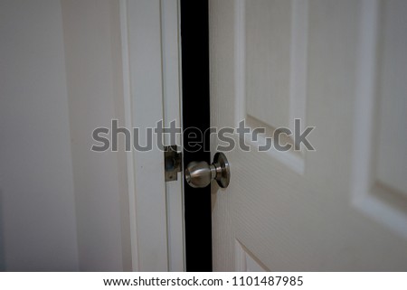 Open white door and dark