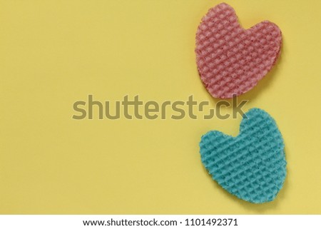 Creative heart from an edible wafer in pastel pink and blue colors. Abstraction. Template. Top view.