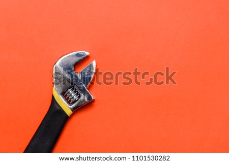 Used Pliers Tools on a orange textured background with space for text