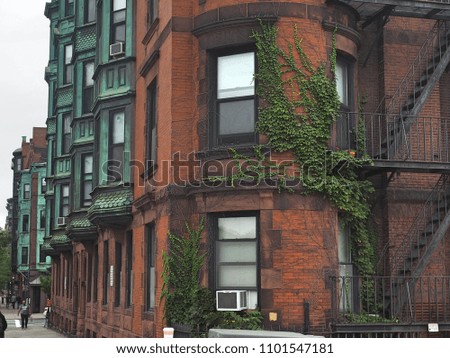 a city street in front of a brick building