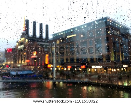 Raindrops on the window with city building on the background at Baltimore USA.