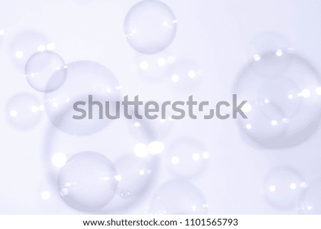 Abstract bright soap bubbles floating in the air 