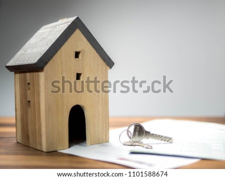 Home model with the key, building, mortgage, real estate and property concept.