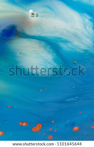 Abstract background. Colorful paints in the water. Splash paint mixing. Art effects.