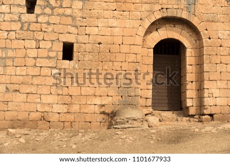 Old Historic Stone Walls and Wooden Old Window Door Detail background.