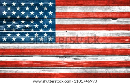 United States of America flag painted over wooden board. Closeup background 