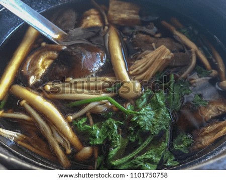 Buk Kut Teh, a Chinese pork soup dish, eat with rice and some vegetable